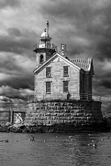 Haunted Middleground Light with Dark Clouds Overhead